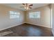 Bedroom with updated flooring and ceiling fan at 3706 Wade Rd, Orlando, FL 32808