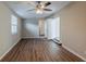 The primary bedroom features wood floors and neutral-colored walls at 3706 Wade Rd, Orlando, FL 32808