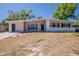 Beautiful single-story home showcasing a long driveway and well-manicured front lawn at 3706 Wade Rd, Orlando, FL 32808