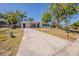 Charming single-story home with a long driveway and a well-maintained front yard at 3706 Wade Rd, Orlando, FL 32808