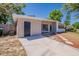 Beautiful single-story home showcasing a long driveway and well-manicured front lawn at 3706 Wade Rd, Orlando, FL 32808