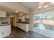 Modern kitchen featuring sleek white cabinets, beautiful backsplash, and stainless steel appliances at 3706 Wade Rd, Orlando, FL 32808