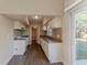 Modern kitchen featuring sleek white cabinets, beautiful backsplash, and stainless steel appliances at 3706 Wade Rd, Orlando, FL 32808