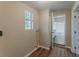 Laundry room with utility connections, neutral paint, window, and modern dark wood flooring at 3706 Wade Rd, Orlando, FL 32808