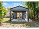 Charming backyard retreat featuring a cozy patio and well-maintained landscaping at 407 E Jersey St, Orlando, FL 32806