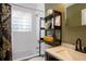 Updated bathroom featuring a shower, shelving, and modern fixtures at 407 E Jersey St, Orlando, FL 32806