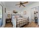 Comfortable bedroom with wood floors, side tables, and plenty of decor at 407 E Jersey St, Orlando, FL 32806