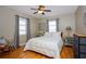 Inviting bedroom with hardwood floors, neutral colors, and plenty of natural light at 407 E Jersey St, Orlando, FL 32806