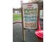 A sign describing angle bar and hurdle exercises at the fitness station at 407 E Jersey St, Orlando, FL 32806