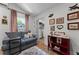 Inviting living room with decor, a comfortable couch, and a view into the closet at 407 E Jersey St, Orlando, FL 32806