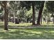 Scenic view of the park featuring a picnic pavilion, lush green grass, and mature trees at 407 E Jersey St, Orlando, FL 32806