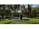 Scenic circular water fountain surrounded by palm trees and lush greenery in a serene park setting at 407 E Jersey St, Orlando, FL 32806