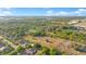An expansive aerial view showcases the lot among beautiful homes, trees and landscaping at 4550 Chandler Rd, Apopka, FL 32712