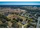 Expansive aerial view of a large lot surrounded by lush greenery and neighboring homes at 4550 Chandler Rd, Apopka, FL 32712