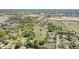 Scenic aerial view of a community near open fields, with houses, trees, and clear demarcation of property lines on a sunny day at 4550 Chandler Rd, Apopka, FL 32712