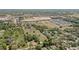 Aerial perspective showing a mix of houses and new construction development, amidst green fields, under a wide, open sky at 4550 Chandler Rd, Apopka, FL 32712