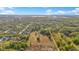 An aerial photograph shows the expansive lot and the quiet community that surrounds it at 4550 Chandler Rd, Apopka, FL 32712