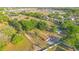 Aerial view showcasing the house, barn, and surrounding landscape at 4550 Chandler Rd, Apopka, FL 32712