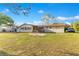 Large backyard with a patio, a well-kept lawn, and a shed at 4550 Chandler Rd, Apopka, FL 32712