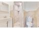Bathroom showcasing a sink, toilet, and a shower with tiled walls at 4550 Chandler Rd, Apopka, FL 32712