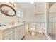 Modern bathroom with marble countertops, a tiled shower, and a window at 4550 Chandler Rd, Apopka, FL 32712