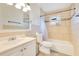 Cozy bathroom with tiled walls, a shower-tub combo, and a vanity at 4550 Chandler Rd, Apopka, FL 32712