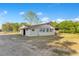 Home exterior showing the side view, yard, and trees at 4550 Chandler Rd, Apopka, FL 32712
