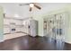 Functional kitchen featuring white cabinets, stainless steel appliances, and a view to the backyard at 4550 Chandler Rd, Apopka, FL 32712