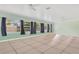 Bright living room features tile floors, multiple windows that provide natural light, and ceiling fans at 4550 Chandler Rd, Apopka, FL 32712