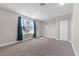 Bedroom featuring plush carpeting, a large window, and a ceiling fan at 4751 Deer Run Rd, St Cloud, FL 34772