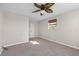 Cozy bedroom features neutral paint, ceiling fan, and carpet at 4751 Deer Run Rd, St Cloud, FL 34772