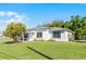Beautifully maintained single Gathering home with a lush green lawn and a white exterior at 4751 Deer Run Rd, St Cloud, FL 34772