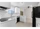 Modern kitchen with white cabinets, stainless appliances, quartz countertop, and a subway tile backsplash at 4751 Deer Run Rd, St Cloud, FL 34772