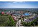 Aerial view of a community with lakes, lush landscaping, and a red map pin indicating the property's location at 4761 Ormond Beach Way, Kissimmee, FL 34746