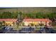 Aerial view shows the property marked with a red pin, surrounded by townhomes and ample parking space at 4761 Ormond Beach Way, Kissimmee, FL 34746
