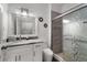 Bathroom with glass shower, granite vanity and commode at 4761 Ormond Beach Way, Kissimmee, FL 34746