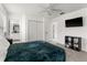 Bright bedroom with ceiling fan, closet, and attached bathroom access at 4761 Ormond Beach Way, Kissimmee, FL 34746