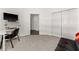 Second bedroom features modern carpet, a desk, and ample closet space at 4761 Ormond Beach Way, Kissimmee, FL 34746
