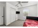 Bedroom with a window, a TV and a double closet at 4761 Ormond Beach Way, Kissimmee, FL 34746