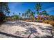 A sandy volleyball court and picturesque palm trees define resort-style living in this vibrant community at 4761 Ormond Beach Way, Kissimmee, FL 34746