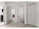 Hallway with stairs, a closet and bedrooms off to the side at 4761 Ormond Beach Way, Kissimmee, FL 34746