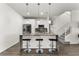 Modern kitchen with stainless appliances, marble island and pendant lighting at 4761 Ormond Beach Way, Kissimmee, FL 34746