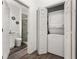 Convenient laundry area with stacked washer and dryer near an adjacent half bathroom at 4761 Ormond Beach Way, Kissimmee, FL 34746