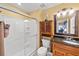 Bathroom featuring a glass-enclosed shower and vanity with wood cabinets at 4772 Vero Beach Pl, Kissimmee, FL 34746