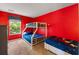Vibrant bedroom featuring a bunk bed with large window, offering bright natural light and playful decor at 4772 Vero Beach Pl, Kissimmee, FL 34746
