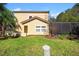 Exterior view of a two-story home with a well-maintained lawn at 4772 Vero Beach Pl, Kissimmee, FL 34746