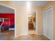 A hallway view of a bunk bedroom on the left and bathroom with vanity on the right at 4772 Vero Beach Pl, Kissimmee, FL 34746