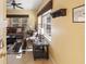Comfortable living room featuring neutral tones, ceiling fan, and natural light at 4772 Vero Beach Pl, Kissimmee, FL 34746