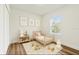 Charming bedroom with a cute bed, playful decor, and a sunlit window view at 4774 Sw 142Nd Place Rd, Ocala, FL 34473