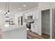 Bright kitchen with white cabinets, a central island, and stainless steel appliances at 4774 Sw 142Nd Place Rd, Ocala, FL 34473